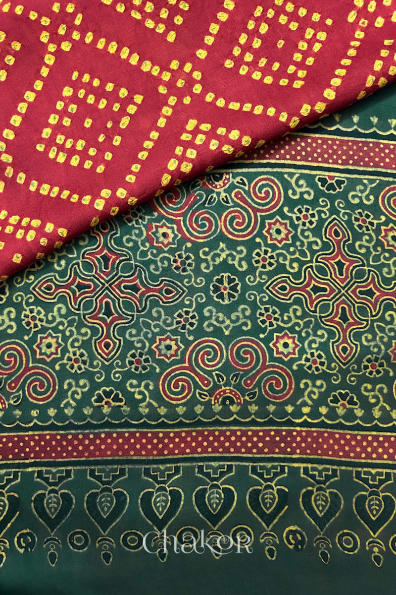 Hand tied  Red Bandhani patterns on modal stole with contrast   Red Ajrakh pallu detail.
