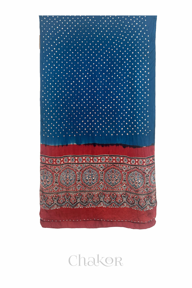 Blue Bandhani modal stole with red Ajrakh pallu and traditional block print layout and glass bead edging.
