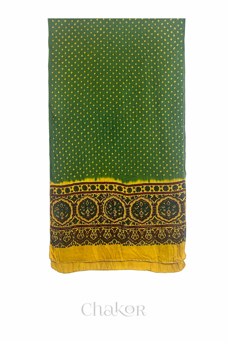  Green Bandhani modal stole with  Mustard Ajrakh pallu and traditional block print layout and glass bead edging.
