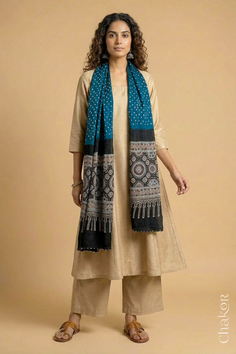 Handcrafted Bandhani Ajrakh modal stole draped on model with indigo blue Bandhani body and black Ajrakh pallu.
