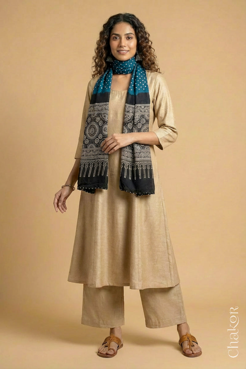 Full length view of handcrafted indigo blue Bandhani stole with iron  black ajrakh pallu worn as dupatta wrapped around the neck.
