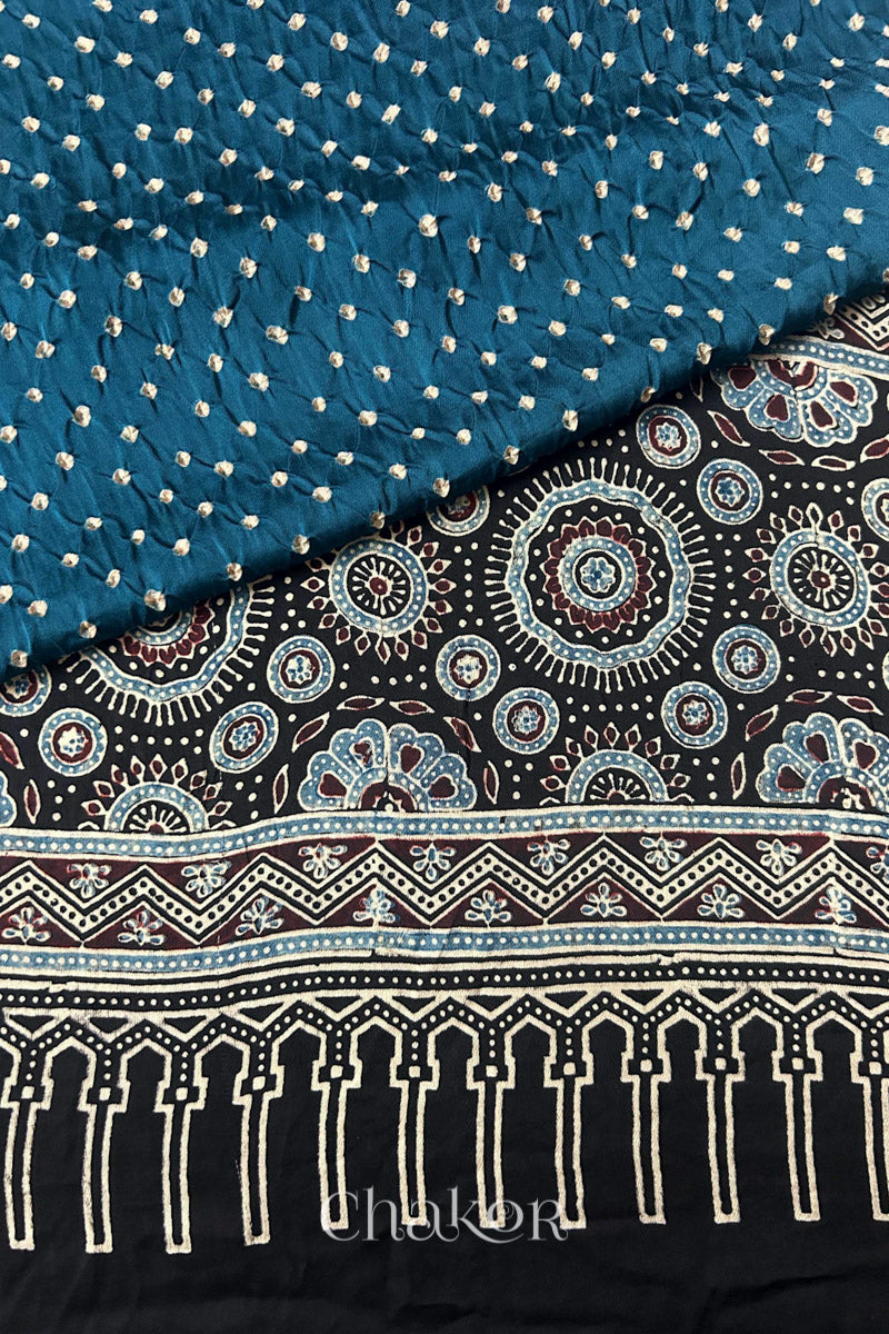 indigo blue Hand tied Bandhani patterns on modal stole with contrast black ajrakh pallu detail.
