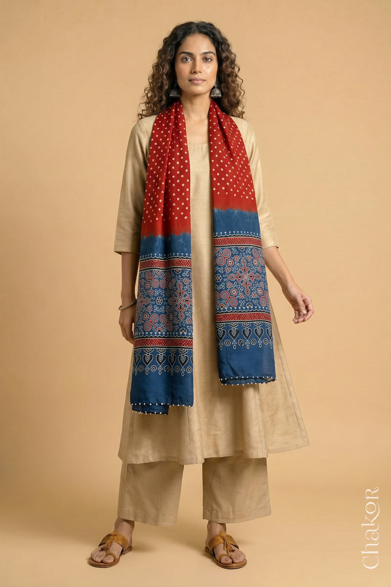 Handcrafted Bandhani Ajrakh modal stole draped on model with Red Bandhani body and Indigo Ajrakh pallu.
