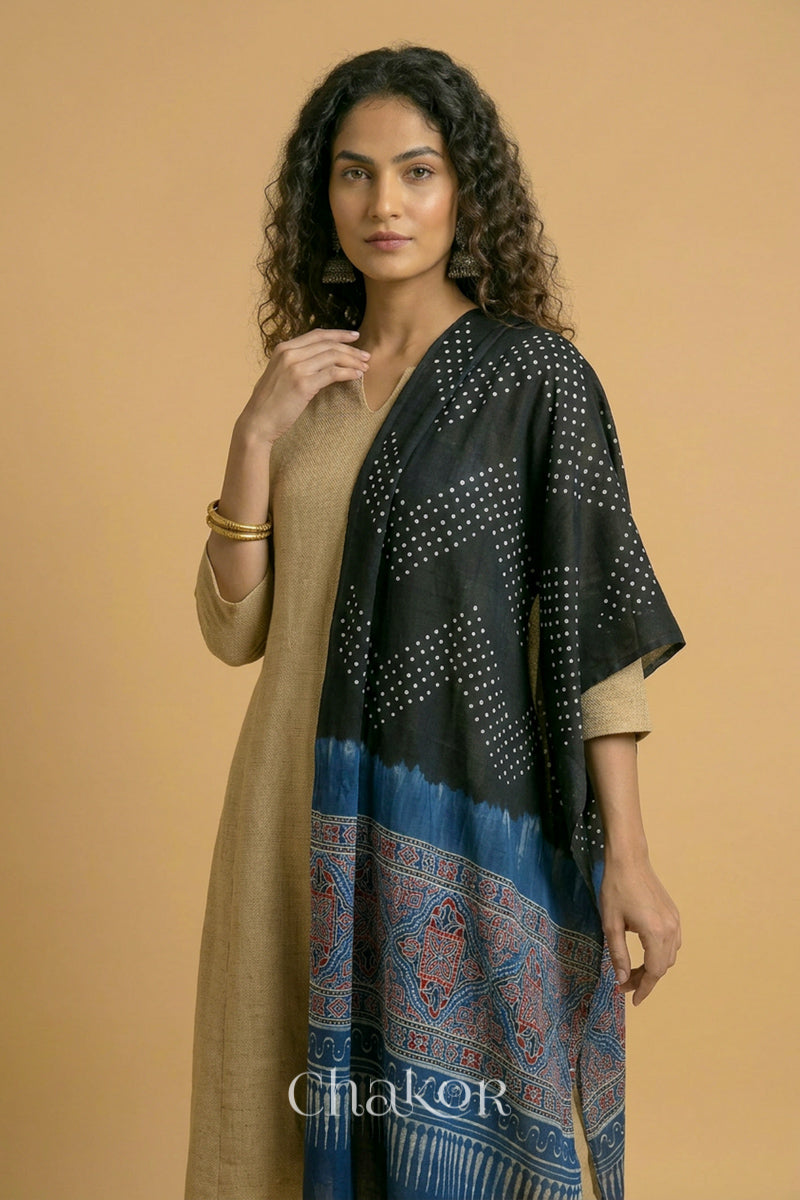 Full length view of handcrafted  Black Bandhani stole with Indigo Ajrakh pallu worn as dupatta draped from shoulder.
