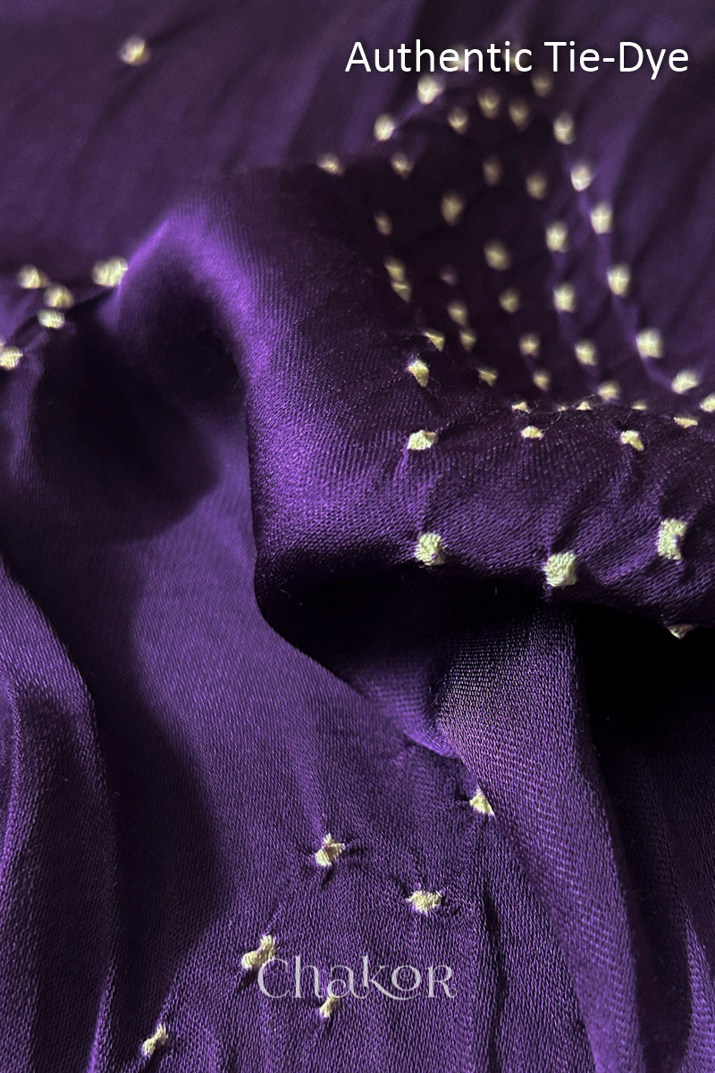 Red Hand tied Bandhani dots on modal stole with contrast ajrakh pallu detail showcasing fabric texture and softness.
