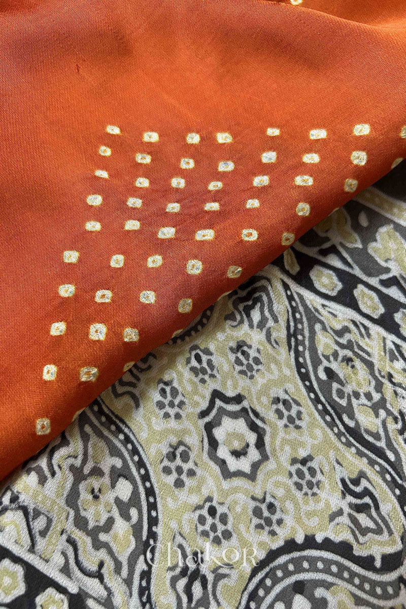 Detailed Ajrakh pattern on modal stole showing traditional hand block printing and intricate bandhani motifs.
