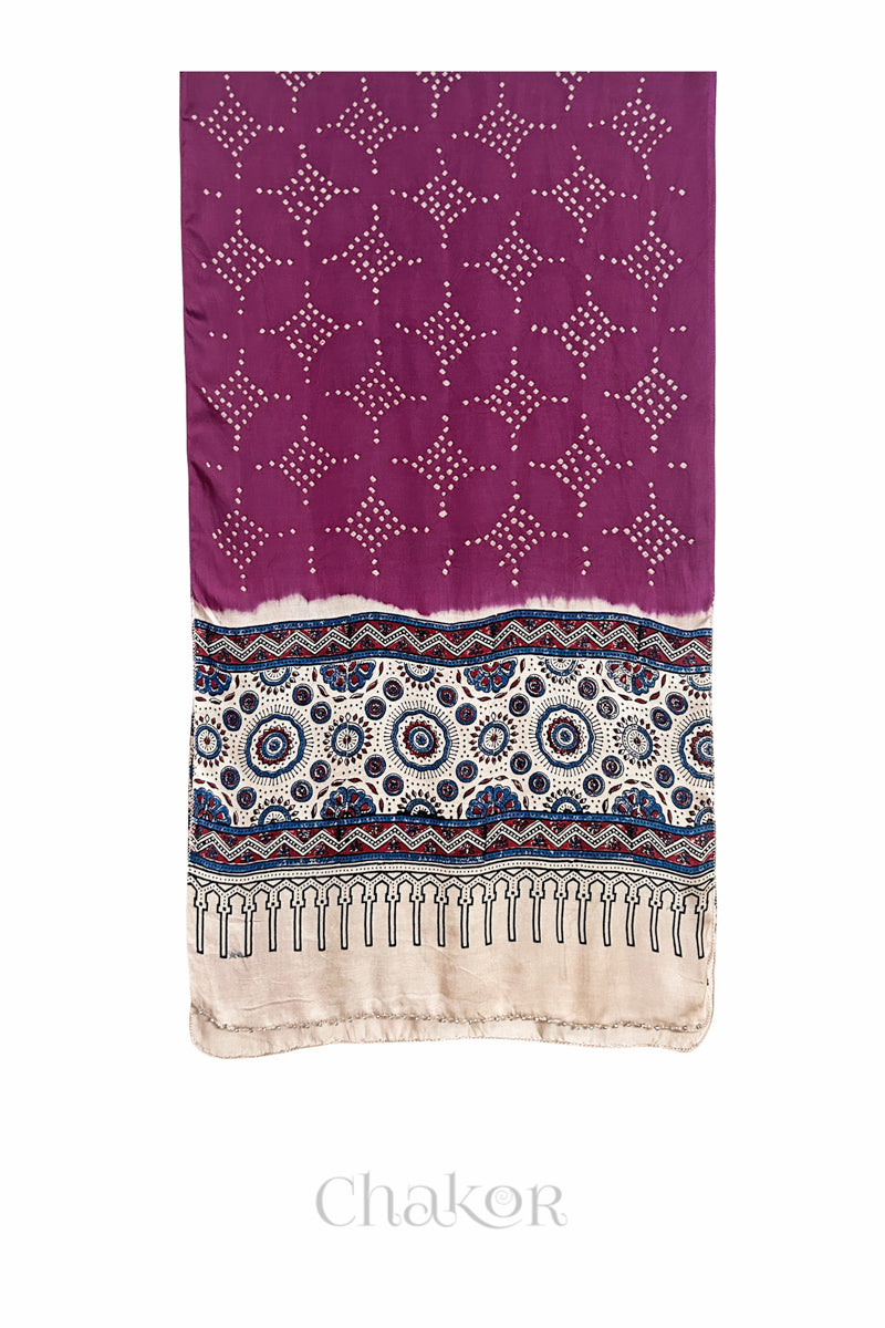 Magenta Bandhani modal stole with  Off-white Ajrakh pallu and traditional block print layout and glass bead edging.
