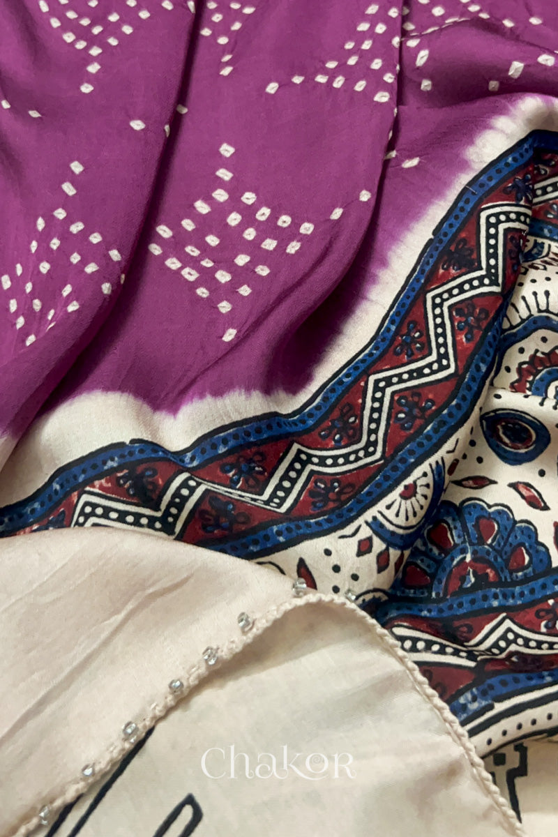 Close up of natural dye Off-white Ajrakh print on handcrafted stole with intricate block printed motifs and delicate bandhani patterns and galss beads edging.
