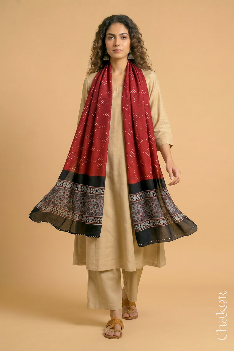 Flowing Red modal Bandhani stole with iron  black  Ajrakh pallu showing movement and lightweight drape.
