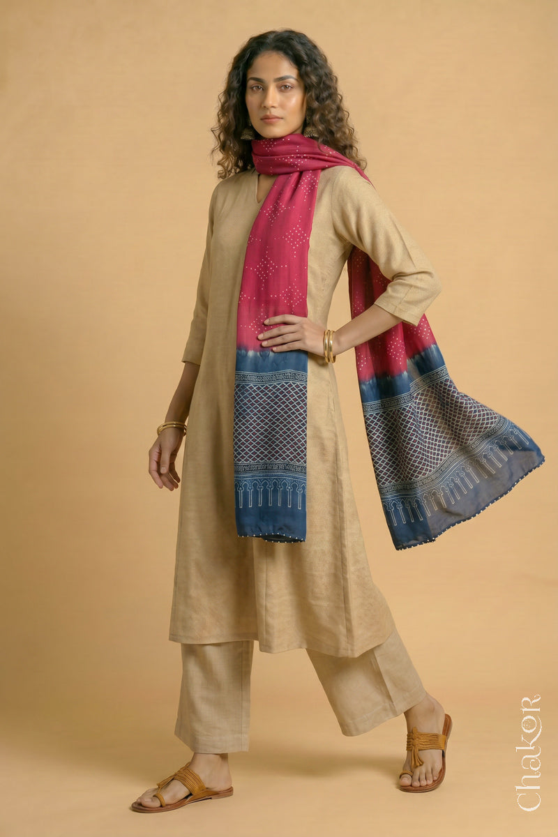 Flowing Strawberry Pink modal Bandhani stole with Indigo  Ajrakh pallu showing flowy and lightweight drape.
