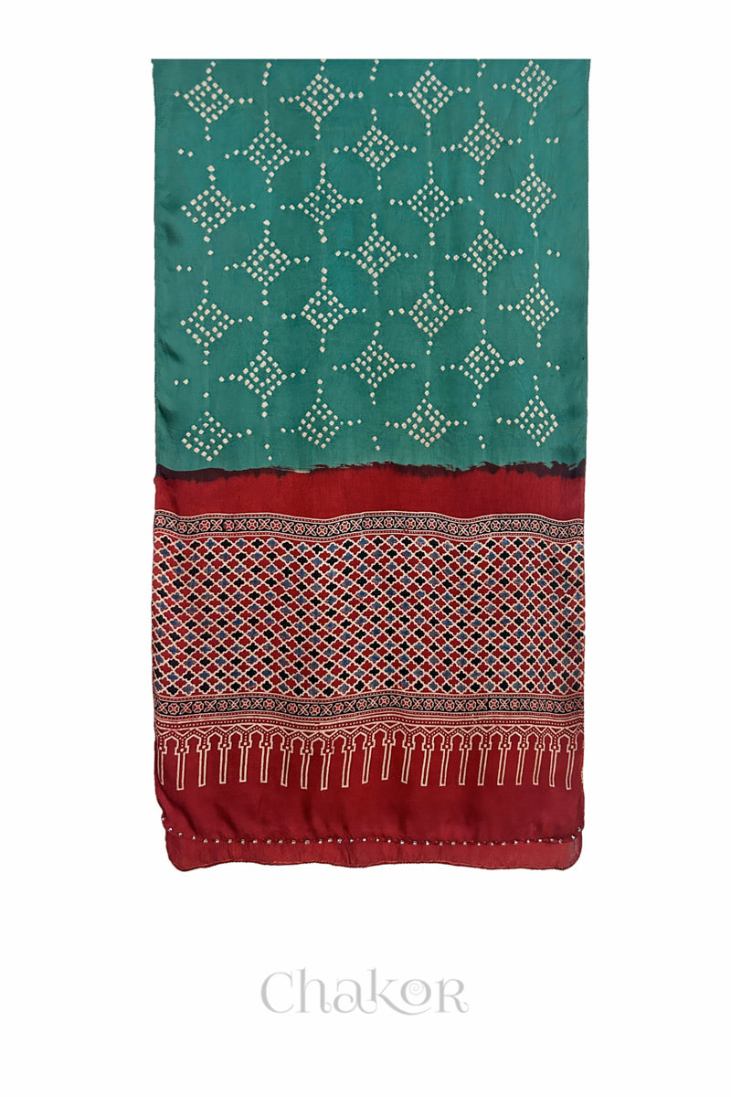 Turtle Green Bandhani modal stole with Manjistha Red Ajrakh pallu and traditional block print layout and glass bead edging.
